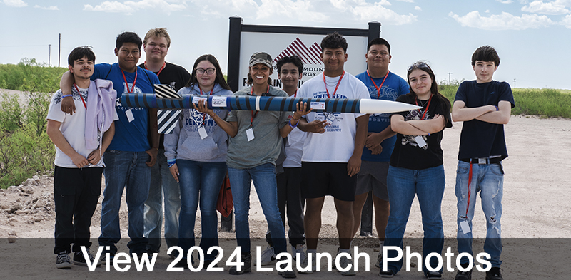 View 2024 Launch Photos with team holding rocket